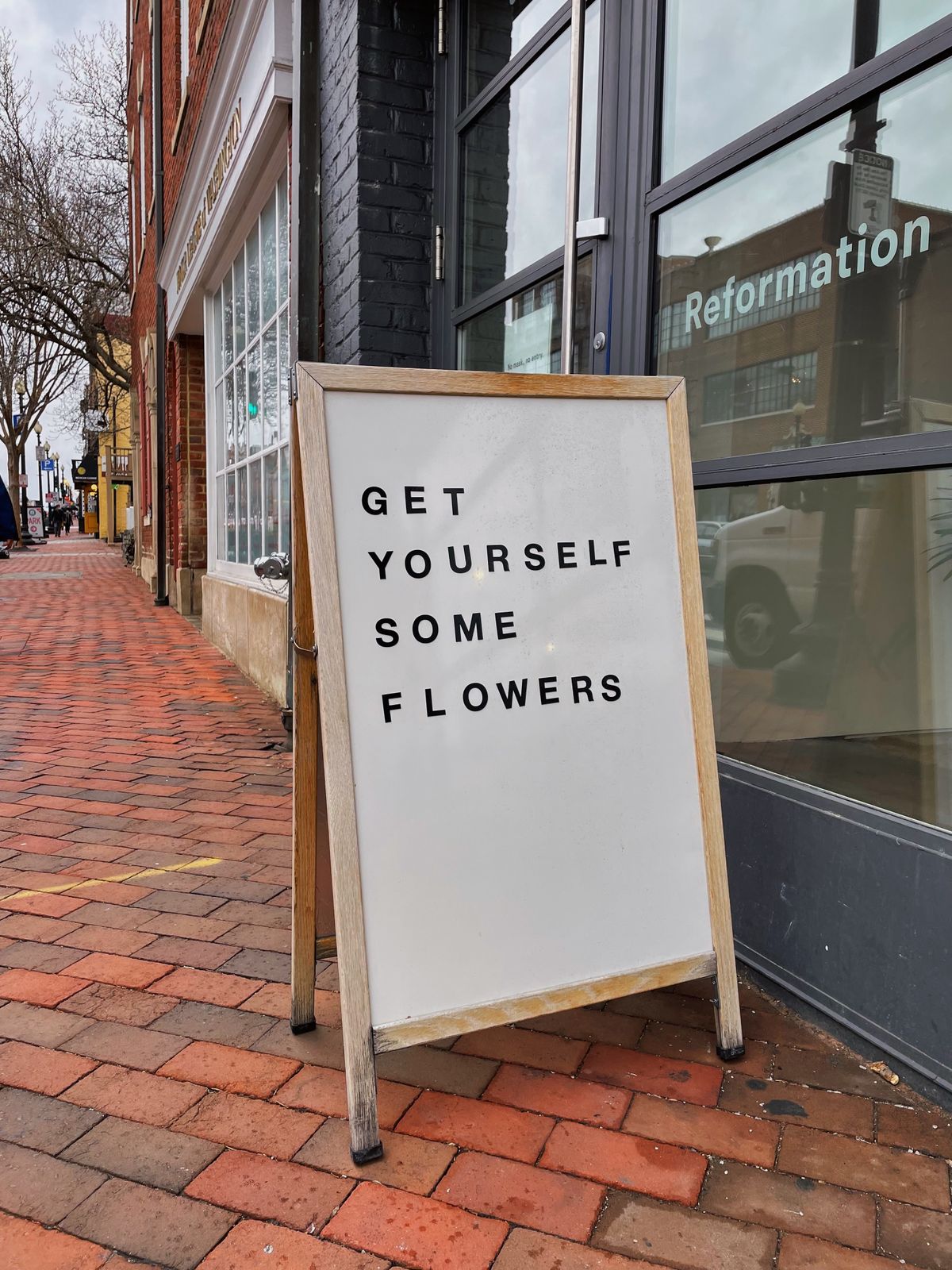 A pavement A-board sign standing outside an independent shop