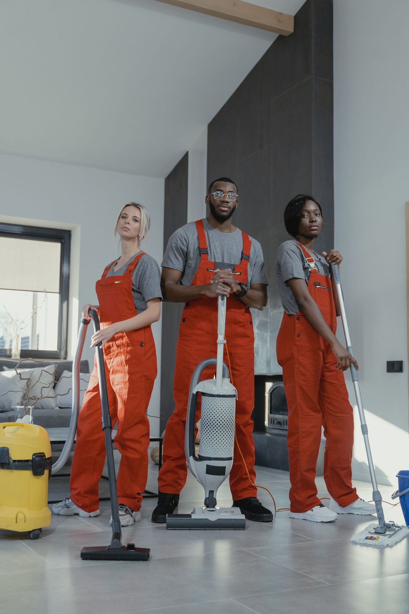 A professional cleaning crew in matching uniform polo shirts