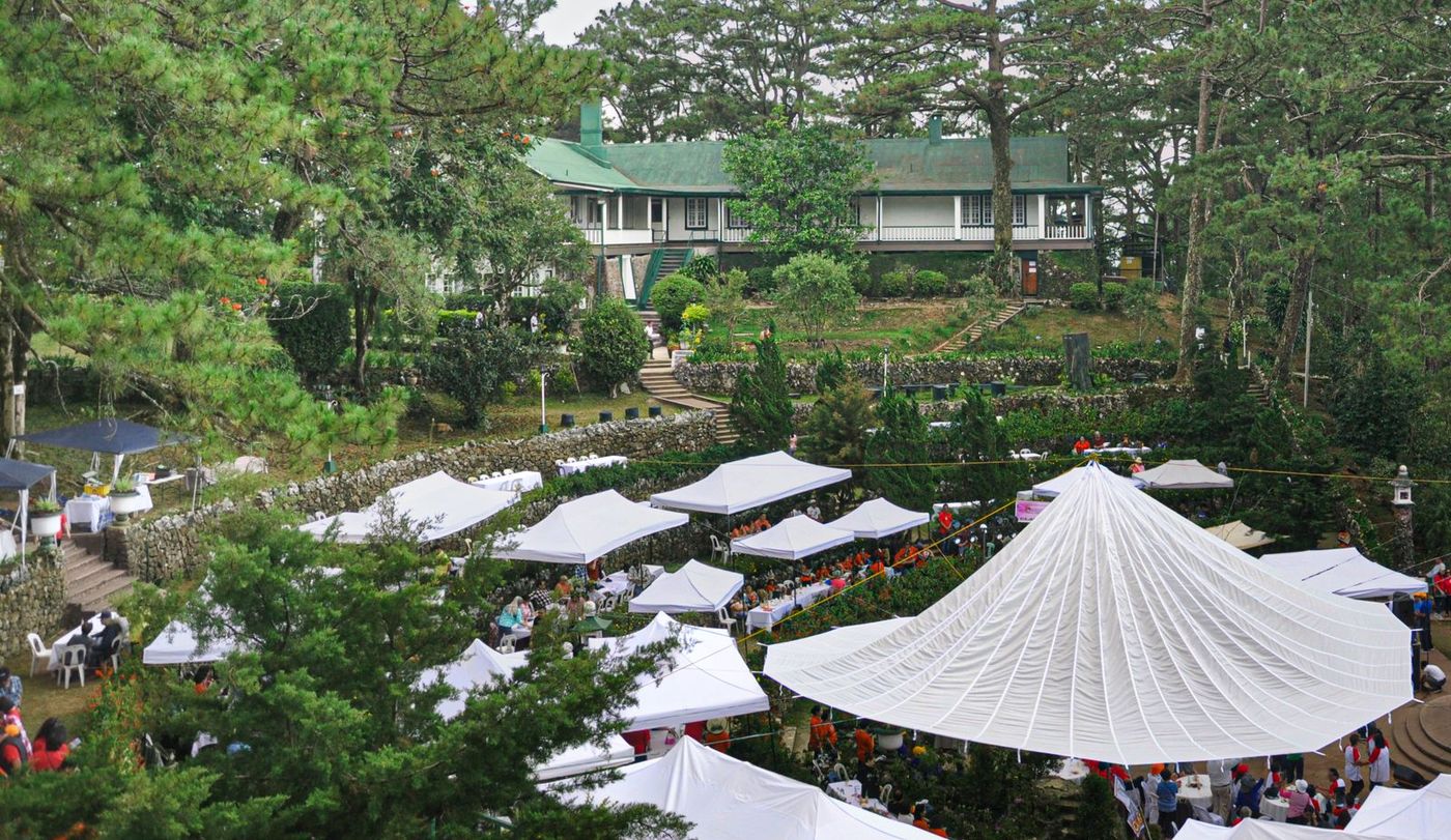 White event gazebos set up at an outdoor fair