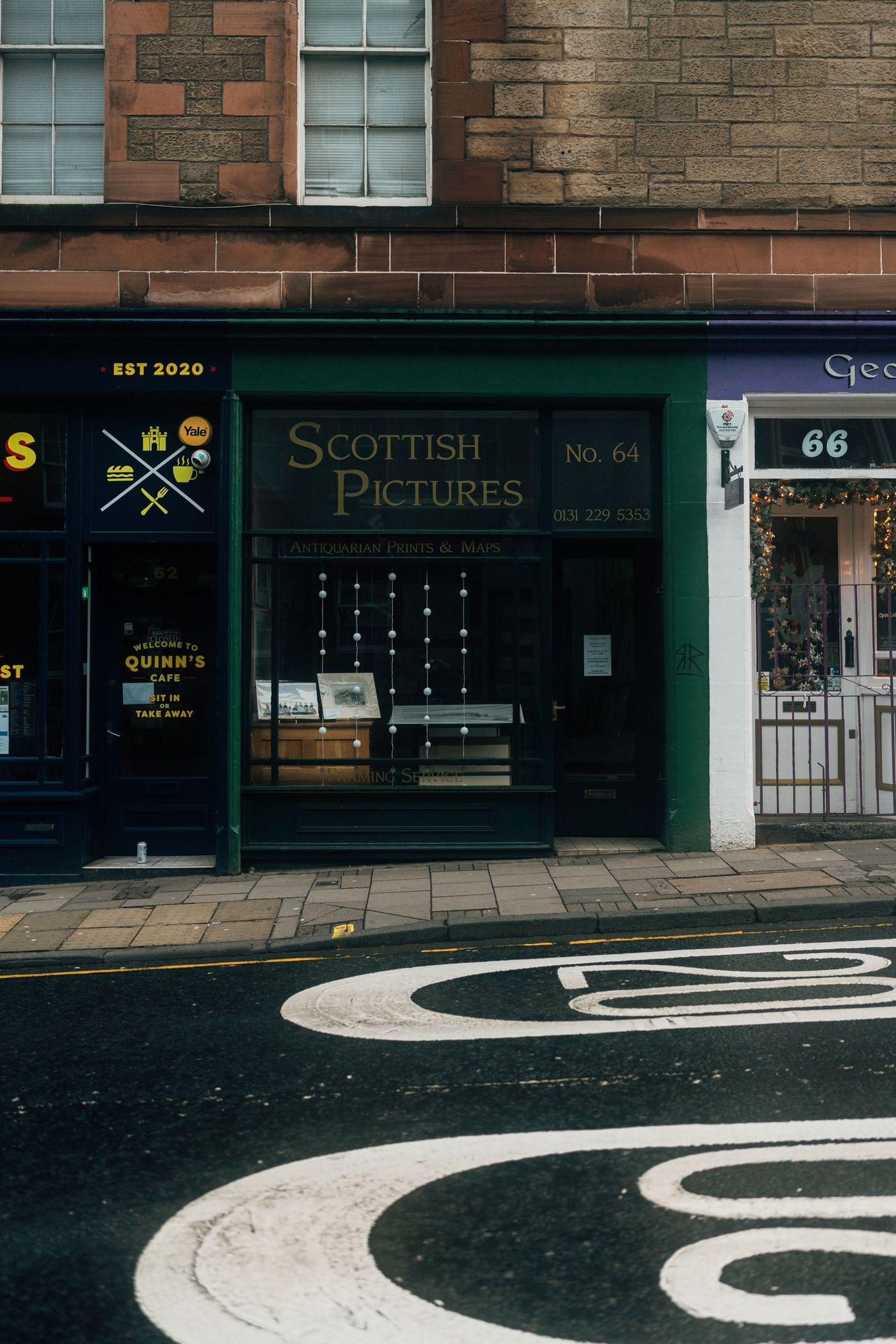 A traditional independent shopfront with painted fascia signage